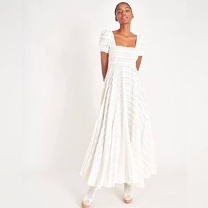 LoveShackFancy's uber-feminine design Ryan dress, is a delicate lace composition